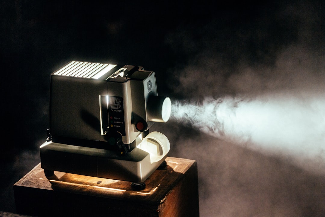 Inside the studio — projector light in a dark room